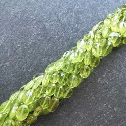 Precious Sparkle Peridot Faceted Oval Beads 15" Strand